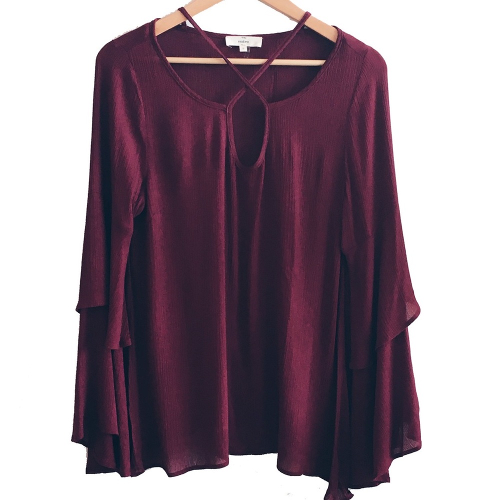 Long, bell sleeved top with cross-cross neckline